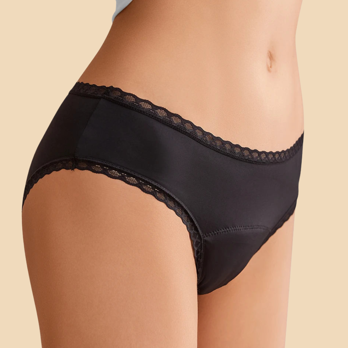 Black lace-trimmed underwear on a beige background