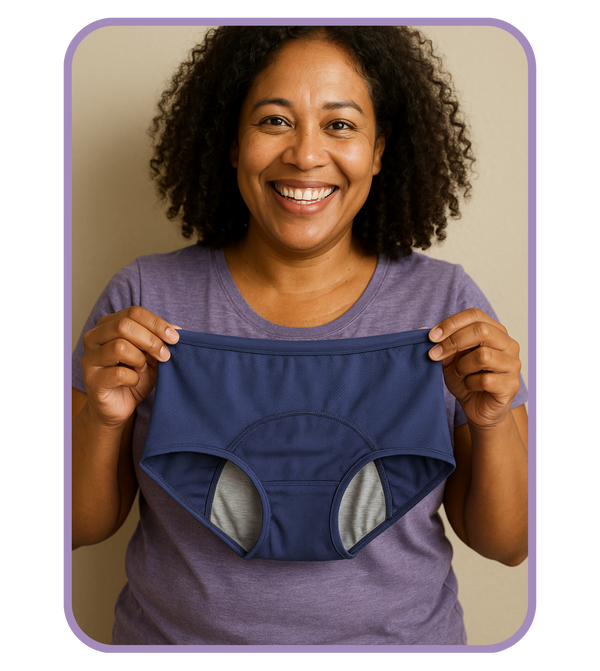 Woman holding a pair of blue underwear against a beige background