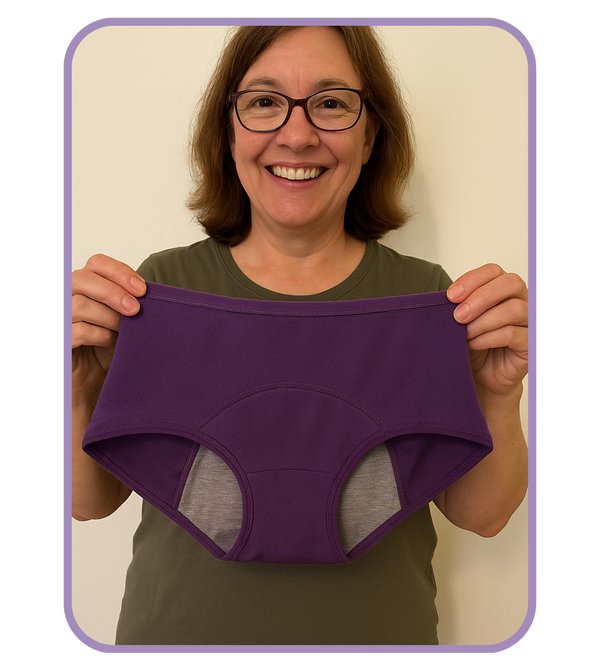 Person holding a purple underwear with a gray interior against a plain background