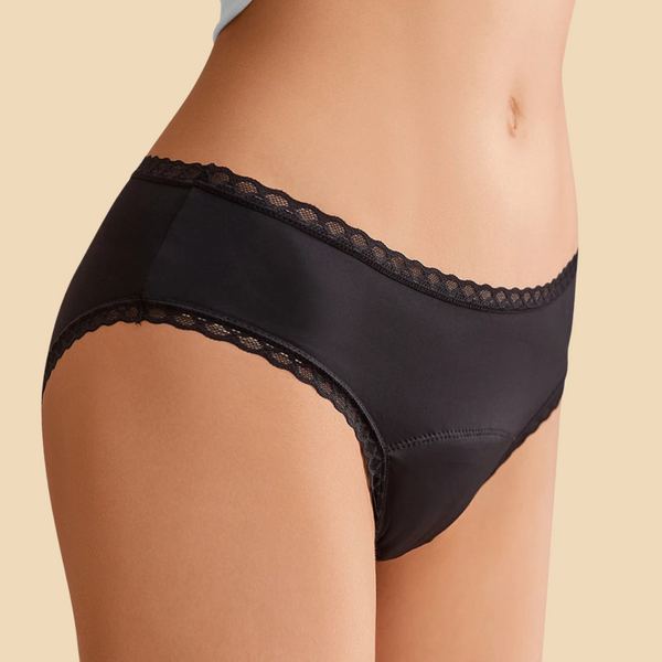Black lace-trimmed underwear on a beige background